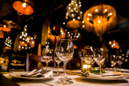 a table setting in a restaurant with lights